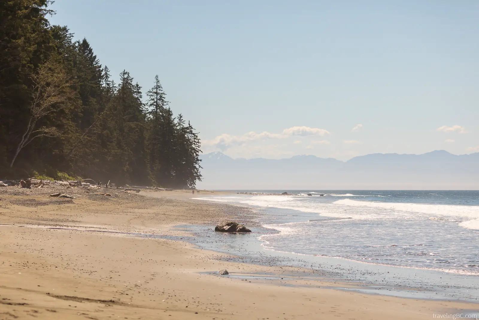 The long sandy beach at China Beach on Vancouver Island, with the mountains in the background