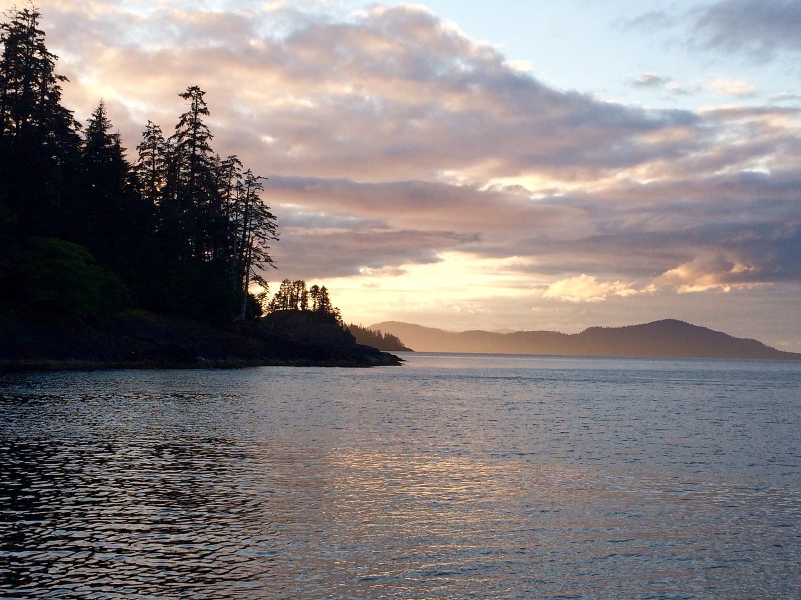 The sunset over Gwaii Haanas National Park Reserve in Haida Gwaii, BC - Photo: Christine Rondeau (CC)