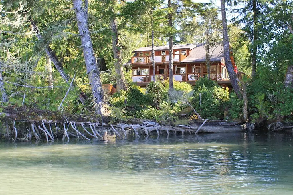 View from the water of Jensen's Bay Vacation Rental Home in Tofino
