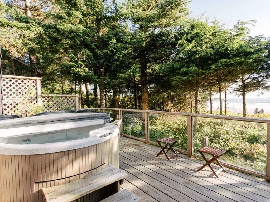 The hot tub and beach view from Michel's Cabin in Tofino