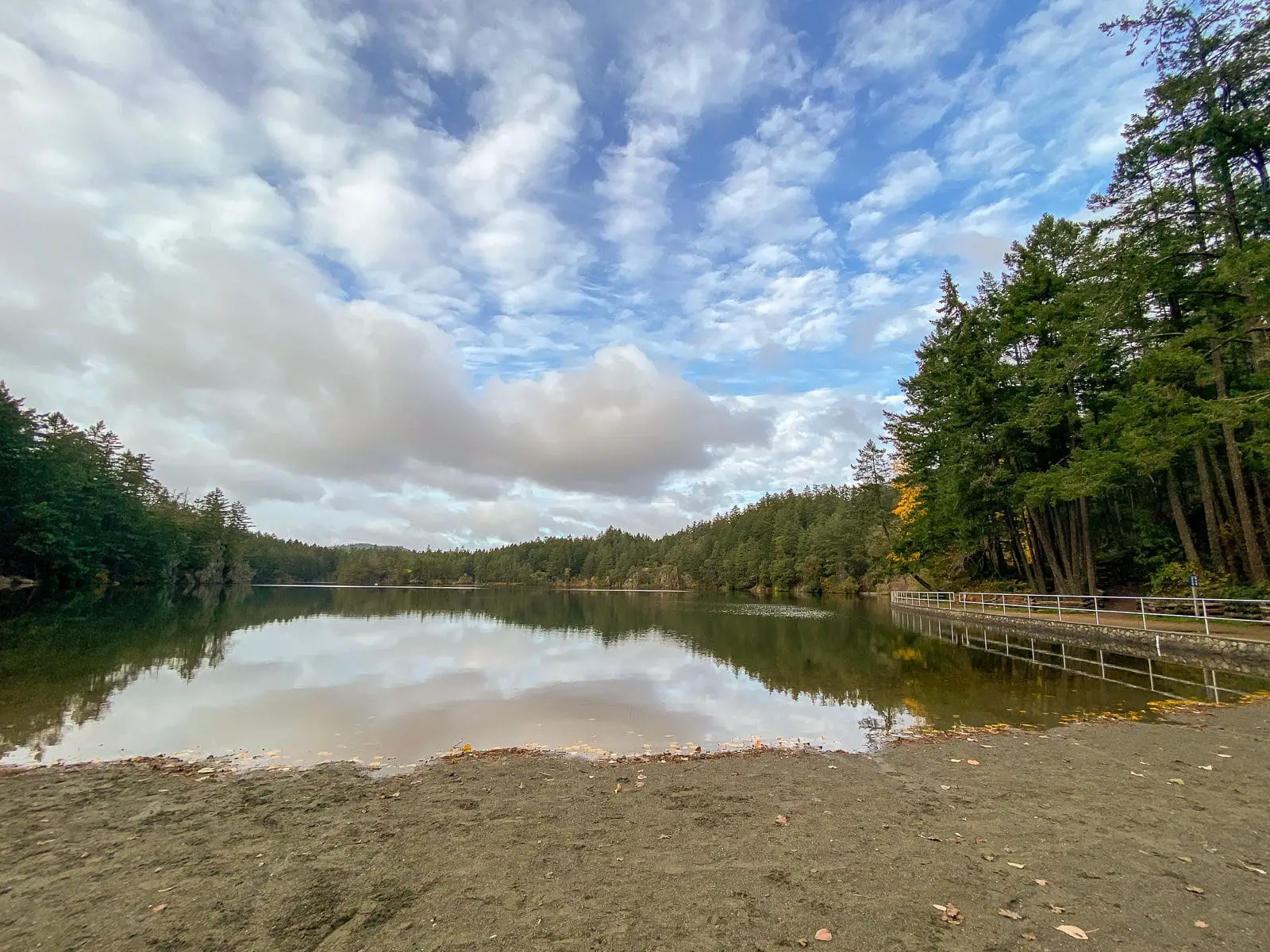 The main beach at Thetis Lake in Victoria, BC during autumn