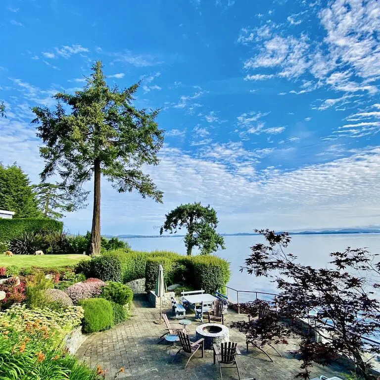 The patio by the ocean at Heron's Retreat, one of the top oceanfront vacation homes in North Saanich in Greater Victoria, BC