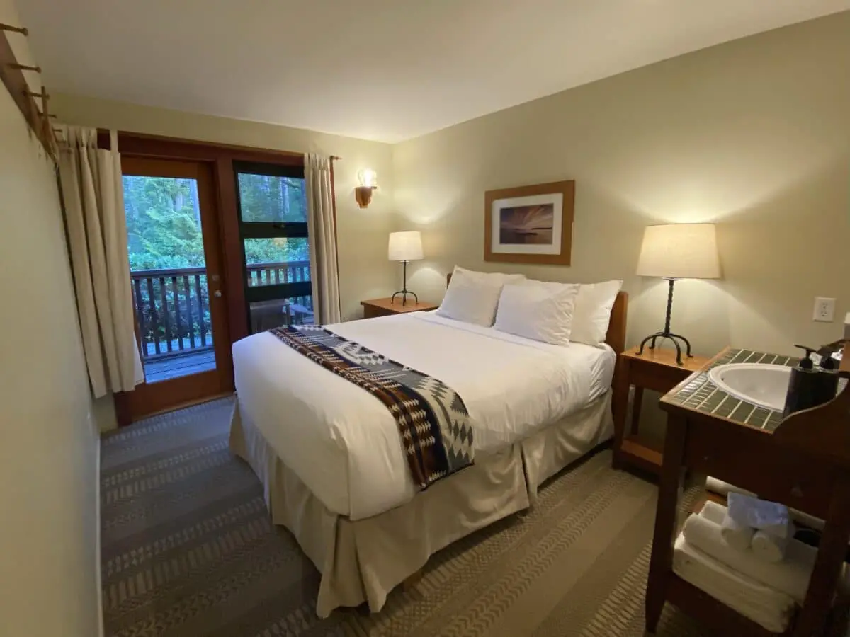 The forest-facing queen bedroom at Middle Beach Lodge in Tofino