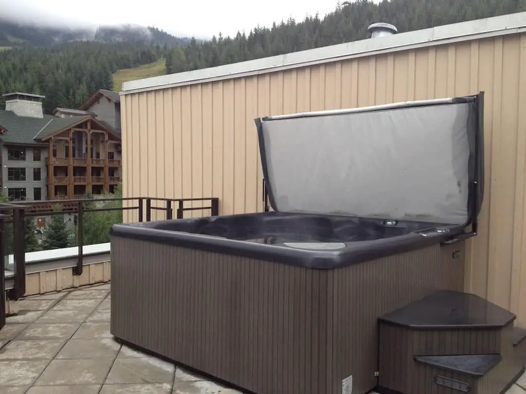 The rooftop private hot tub at the Lake Placid Lodge Penthouse, one of the best VRBOs with a private hot tub
