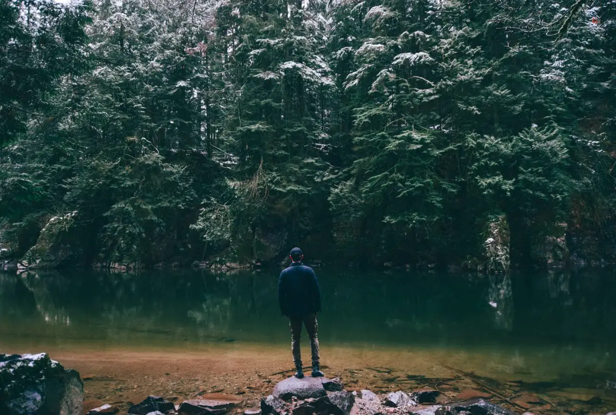 A man standing by the water in North Vancouver