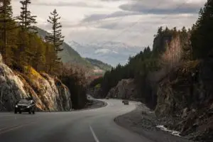 A car driving on the Sea-to-Sky Highway in BC