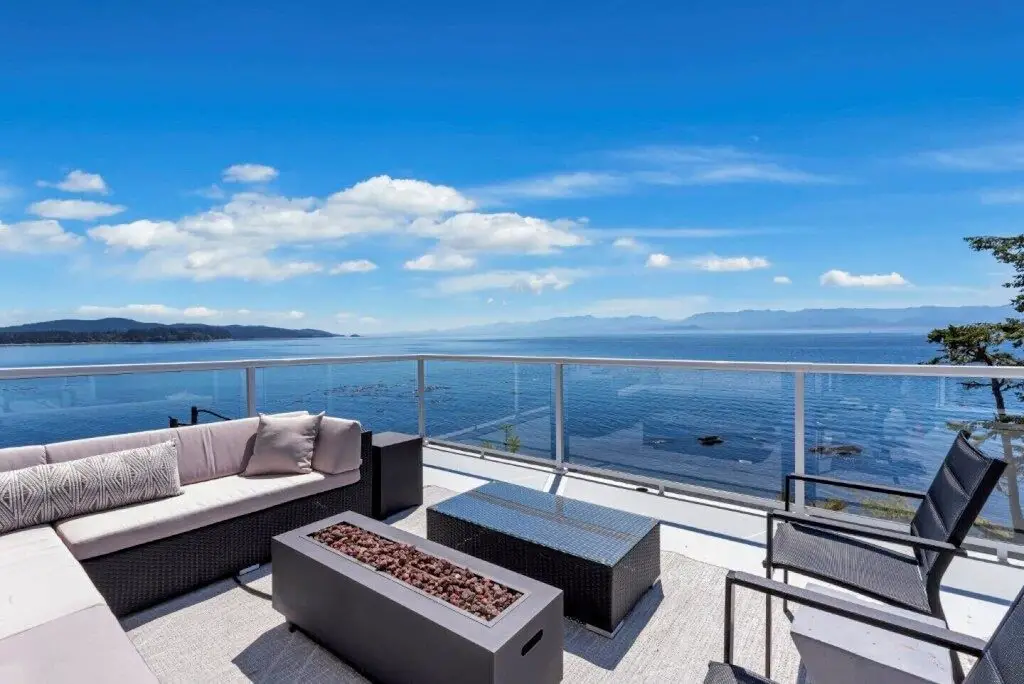 The oceanfront patio at Seawood Oceanfront Suite, one of the best vacation home rentals in Sooke