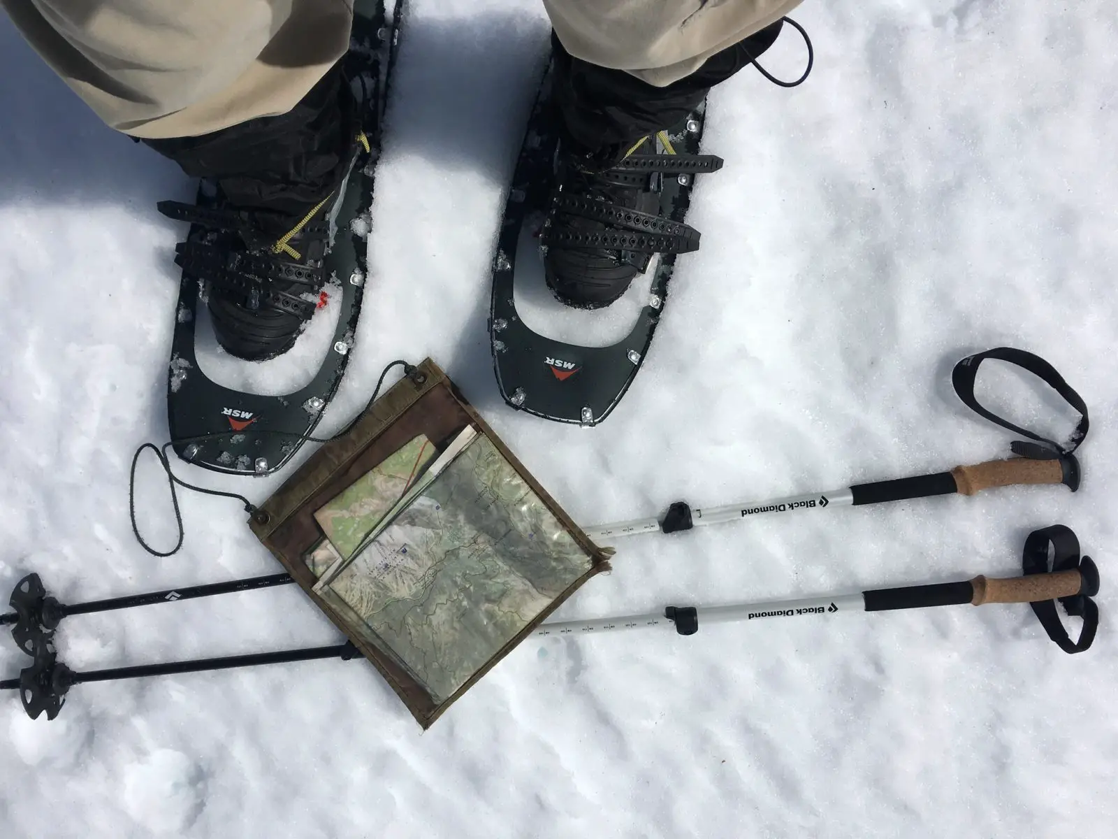 Snowshoes, trekking poles, and a map - Photo: Rupert Essinger